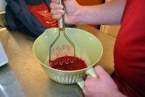 Mashing the raspberries for the jam.