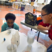 Making their own storm water experiment.